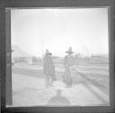 Two mexican men at station