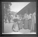 Mexican woman boarding train