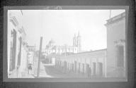 [Townscape with cathedral in distance]
