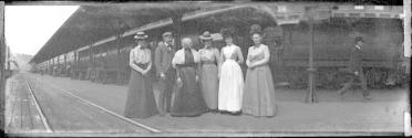 George Eastman's companions on train station platform, California Trip