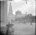 Boy in city-big building in background