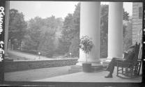 Man on porch of Otesaga Hotel, Cooperstown Trip