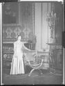 Young unidentified woman in unidentified house