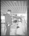 Man and child on deck of ship