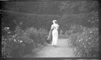 Woman walking on garden path