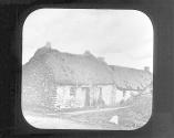 [House with thatched roof]