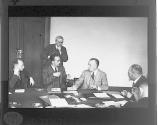 [Dr. Walter J. Clark, talking to group at International Conference on Photo Speed, Munich]