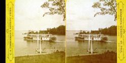 [Paddle boat steamer on river, likely Mississippi River]