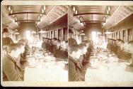 [Group eating a meal on a train]