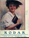 Advertisement for Kodak & Brownie cameras featuring the Kodak Girl