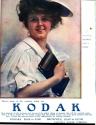 Advertisement for Kodak & Brownie cameras featuring the Kodak Girl