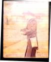 Woman using Folding Pocket Kodak Camera