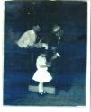 Young girl holding Kodak Brownie in camera store