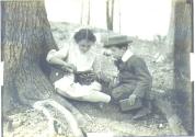Girl and boy using Folding Pocket Kodak camera