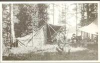 Camping tent and two people outside the tent, Wyoming Trip