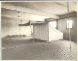 Eastman's camping tent set up inside garage