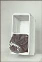 Box containing a cloth bag