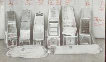 Several wooden compartmented storage cases