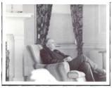 George Dryden with cigar sitting in chair