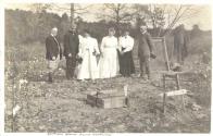 George Eastman and guests inspecting cornerstone of cabin, Oak Lodge Trip