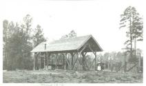 Shed and two women at Oak Lodge
