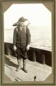 Hunting companion on ship's deck with dead eagle, Pacific Coast Trip