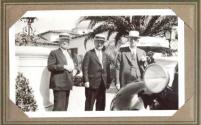 George Eastman and two men near automobile