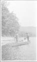 Eleanor Eastwood being rowed in canoe, Grand Cascapedia Trip