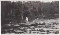 Woman fishing in canoe, Grand Cascapedia Trip