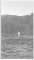Woman fishing in canoe, Grand Cascapedia Trip