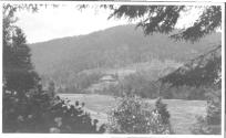 View of lodge across meadow, Grand Cascapedia Trip