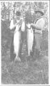 Fishing companions with fish, Grand Cascapedia Trip