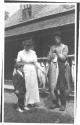 Nell and Watson Newhall looking at fish, Grand Cascapedia Trip