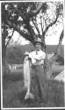 Charles Newhall showing off fish, Grand Cascapedia Trip