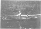 Woman fishing in canoe, Grand Cascapedia Trip