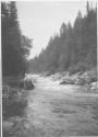 Woman by rapids, Grand Cascapedia Trip