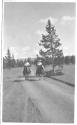 Man & woman riding on trail, Wyoming Trip