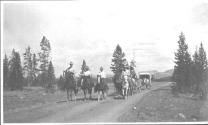 Riders and wagons on road, Wyoming Trip