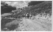 Riders descending trail toward Old Faithful Inn, Wyoming Trip