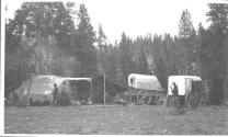 Wagons beside campsite, Wyoming Trip
