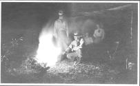 George Eastman and companions by campfire at night, Wyoming Trip