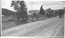 Riders and wagon near geyser, Wyoming Trip