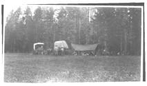 Campsite set up beside wagons, Wyoming Trip