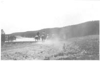 Riders on trail beside river, Wyoming Trip