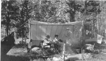 George Eastman and companions dining in tent, Wyoming Trip