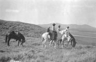 Riders with mountains in distance, Wyoming Trip