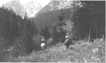 Riders descending hill, Wyoming Trip