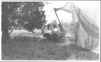 Eastwoods dining with Josephine Dickman at campsite, Wyoming Trip
