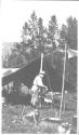 George Eastman cooking at campsite, Wyoming Trip