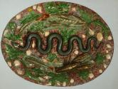 [Ceramic charger with snake motif]